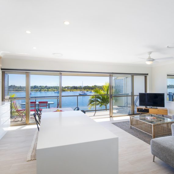 Noosa-Shores-Two-Bedroom-Deluxe-Apartment kitchen and loungeroom with Noosa River view
